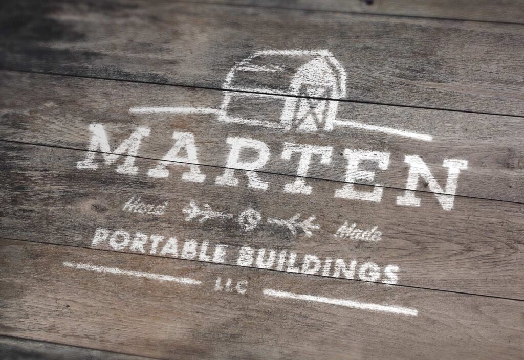 Marten Portable Buildings logo painted on wood