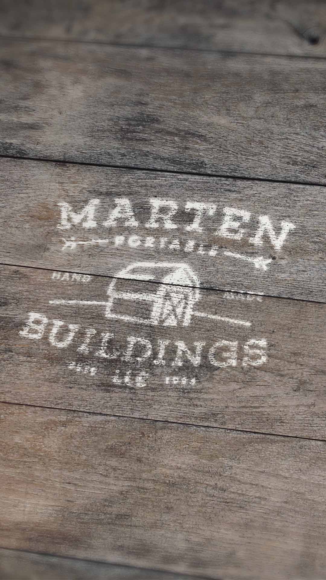 marten portable buildings logo mocked up on wood