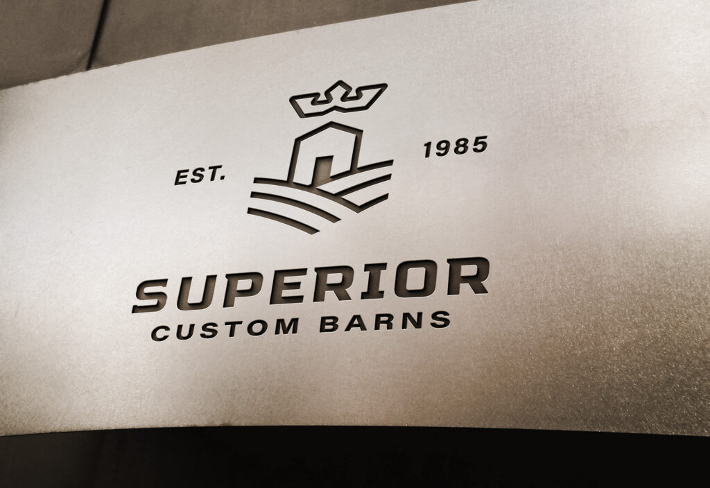 Superior Custom Barns logo design on metal